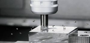 Plain milling operation on a horizontal milling machine cutting a flat metal surface