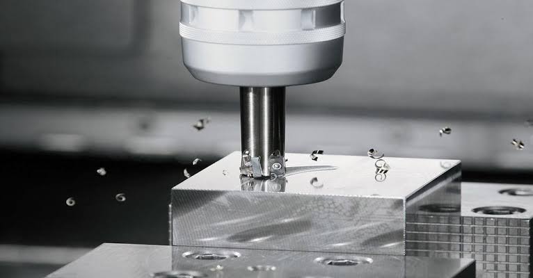 Plain milling operation on a horizontal milling machine cutting a flat metal surface