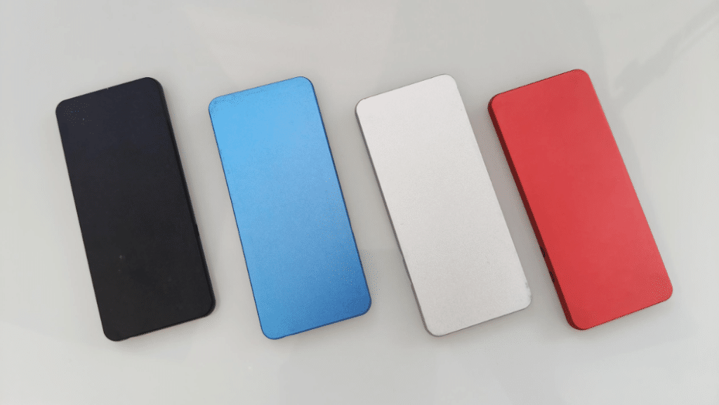 Matte anodized aluminum panels in black, light blue, silver, and red