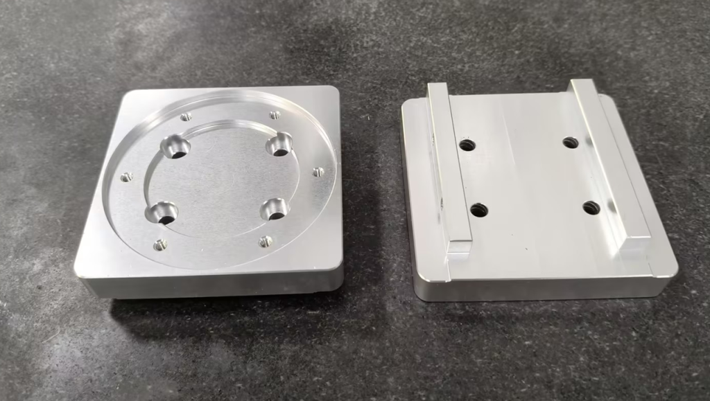 CNC machined aluminum parts combining face milled flat surfaces with end milled holes and features