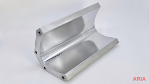Polished aluminum part with a smooth, reflective machined surface