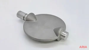 Machined metal disc with two cylindrical pins after passivation